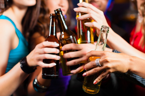 People drinking beer in bar or club