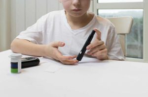 Boy measure glucose or blood suger level