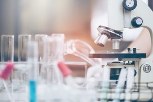 Young Asian Scientist are certain activities on experimental science like mixing chemicals or entry data to develop medicine, foods for everyone on the world, film effect.